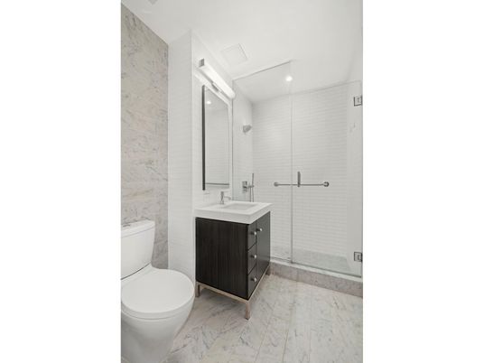 Bathroom, Dual Sink Vanities, Glass Shower, Interior, Marble, Marble Walls, Recessed Lighting