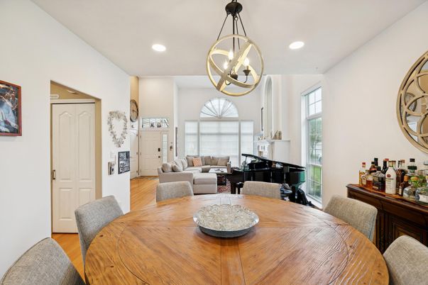 Dining room, Interior, Living room, Pendant Lights, Piano, Recessed Lighting, Wood Texture Flooring