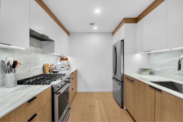 Interior, Kitchen, Marble Walls, Recessed Lighting, Stainless Steel Appliances, Wood Texture Flooring