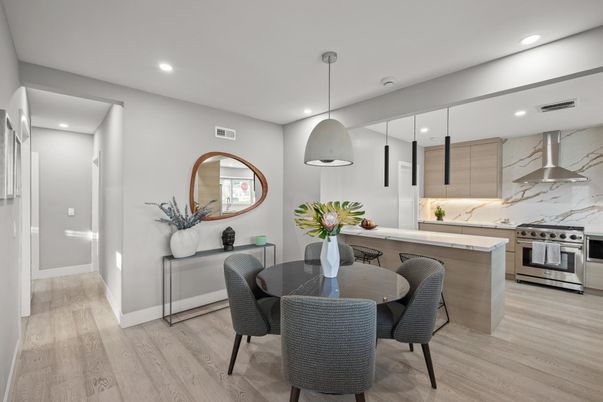Dining room, Interior, Kitchen, Marble Walls, Pendant Lights, Recessed Lighting, Stainless Steel Appliances, Wood Texture Flooring