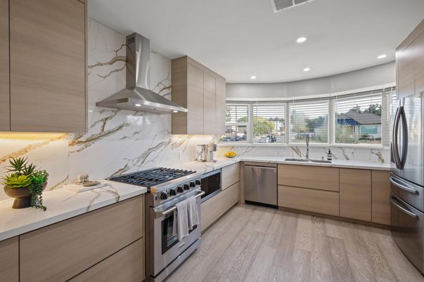 Interior, Kitchen, Marble Walls, Recessed Lighting, Stainless Steel Appliances, Wood Texture Flooring