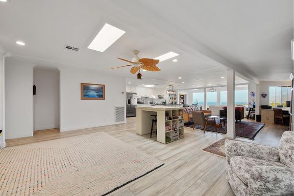 Dining room, Interior, Kitchen, Living room, Recessed Lighting, Water, Wood Texture Flooring