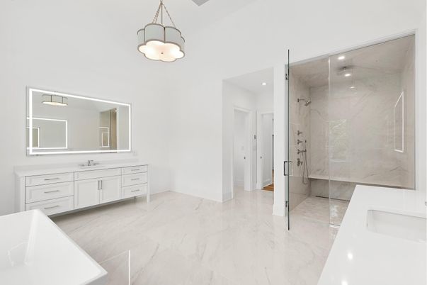 Bathroom, Dual Sink Vanities, Glass Shower, Interior, Marble, Marble Walls, Pendant Lights, Recessed Lighting