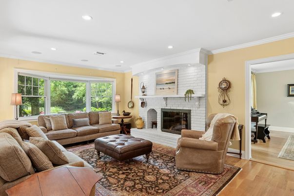 Fireplace, Interior, Living room, Piano, Recessed Lighting, Stone Walls, Wood Texture Flooring