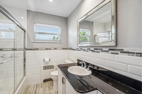Bathroom, Dual Sink Vanities, Glass Shower, Interior, Recessed Lighting, Wood Texture Flooring