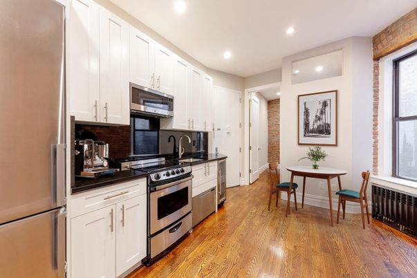 Dining room, Interior, Kitchen, Recessed Lighting, Stainless Steel Appliances, Stone Walls, Wood Texture Flooring