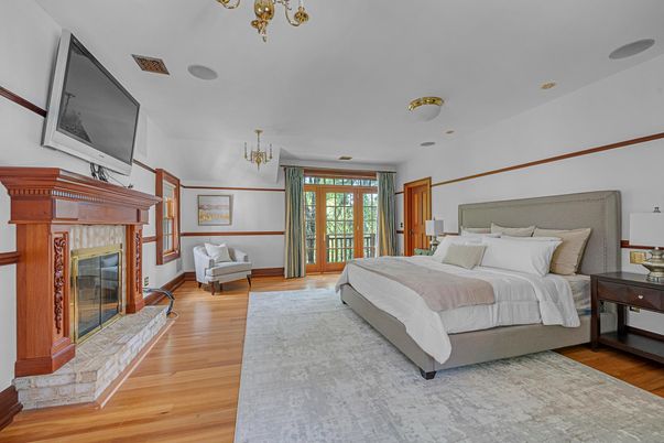 Bedroom, Chandelier, Fireplace, Interior, Recessed Lighting, Wood Texture Flooring