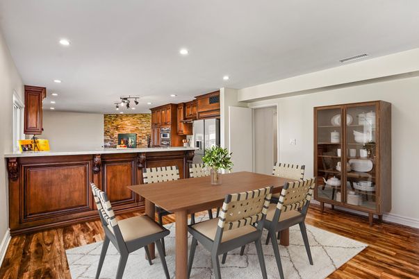 Dining room, Fireplace, Interior, Kitchen, Recessed Lighting, Stainless Steel Appliances, Stone Walls, Wood Texture Flooring