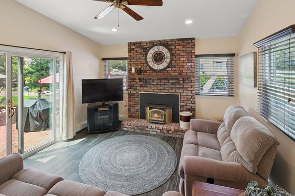 Fireplace, Interior, Living room, Recessed Lighting, Stone Walls, Wood Texture Flooring