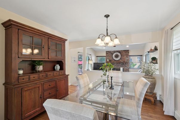 Chandelier, Dining room, Fireplace, Interior, Recessed Lighting, Stone Walls, Wood Texture Flooring
