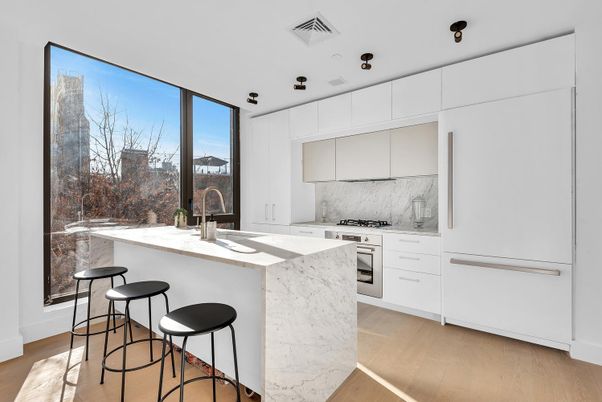 Interior, Kitchen, Marble Walls, Recessed Lighting, Stainless Steel Appliances, Wood Texture Flooring