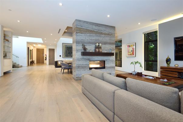 Dining room, Fireplace, Interior, Living room, Recessed Lighting, Stone Walls, Wood Texture Flooring