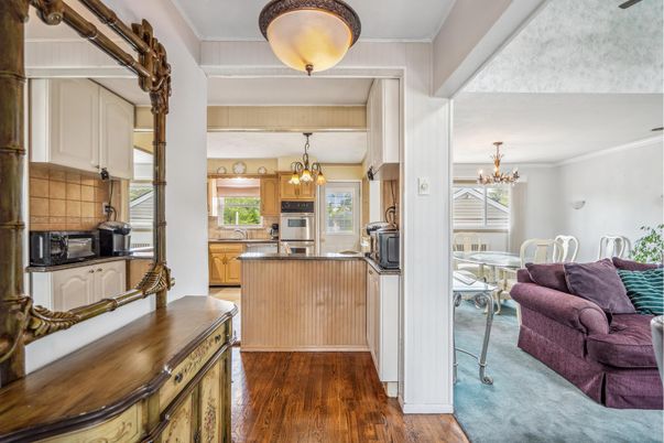 Chandelier, Dining room, Interior, Kitchen, Stainless Steel Appliances, Wood Texture Flooring