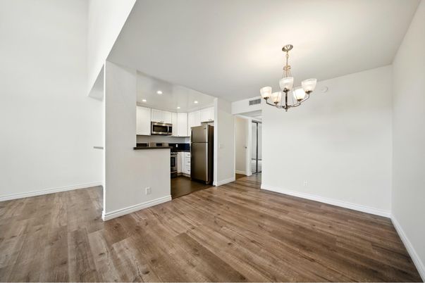 Chandelier, Empty room, Interior, Kitchen, Recessed Lighting, Stainless Steel Appliances, Wood Texture Flooring