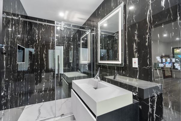 Bathroom, Dual Sink Vanities, Glass Shower, Interior, Marble, Marble Walls, Recessed Lighting
