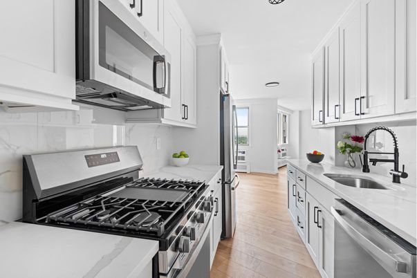 Interior, Kitchen, Marble Walls, Recessed Lighting, Stainless Steel Appliances, Wood Texture Flooring