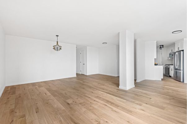 Empty room, Interior, Kitchen, Pendant Lights, Stainless Steel Appliances, Wood Texture Flooring