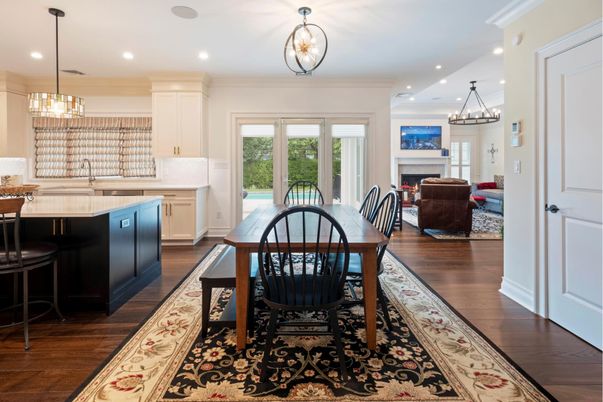 Chandelier, Dining room, Fireplace, Interior, Living room, Pendant Lights, Recessed Lighting, Wood Texture Flooring