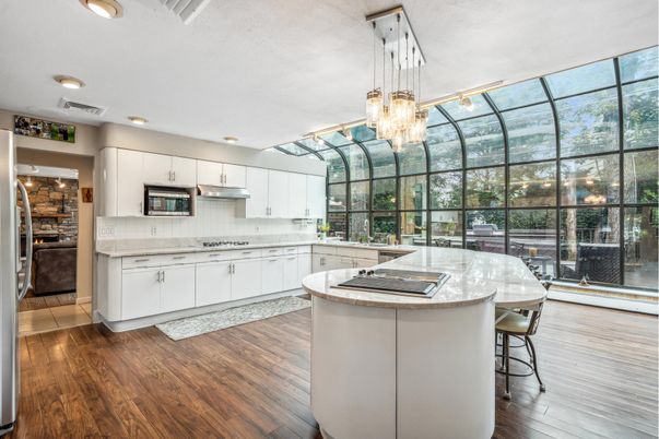 Chandelier, Glass Ceilings, Interior, Kitchen, Pendant Lights, Recessed Lighting, Sun Room, Wood Texture Flooring