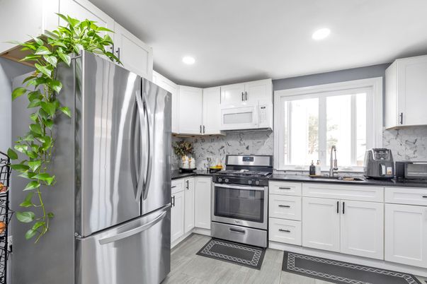 Interior, Kitchen, Marble Walls, Recessed Lighting, Stainless Steel Appliances, Wood Texture Flooring