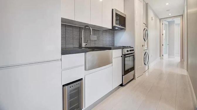 Interior, Kitchen, Recessed Lighting, Washer, Wood Texture Flooring