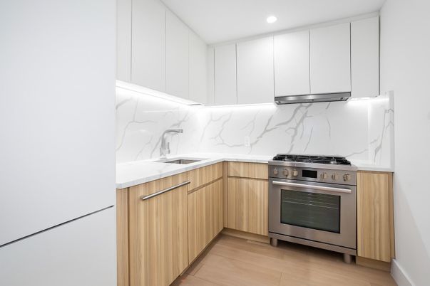 Interior, Kitchen, Marble Walls, Recessed Lighting, Stainless Steel Appliances, Wood Texture Flooring