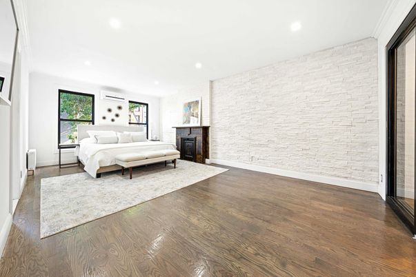 Bedroom, Fireplace, Interior, Recessed Lighting, Stone Walls, Wood Texture Flooring