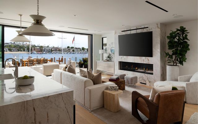 Dining room, Fireplace, Interior, Living room, Pendant Lights, Recessed Lighting, Water, Wood Texture Flooring