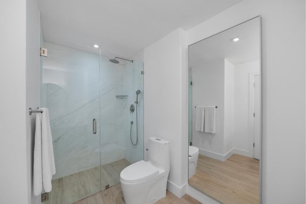 Bathroom, Glass Shower, Interior, Marble Walls, Recessed Lighting, Wood Texture Flooring