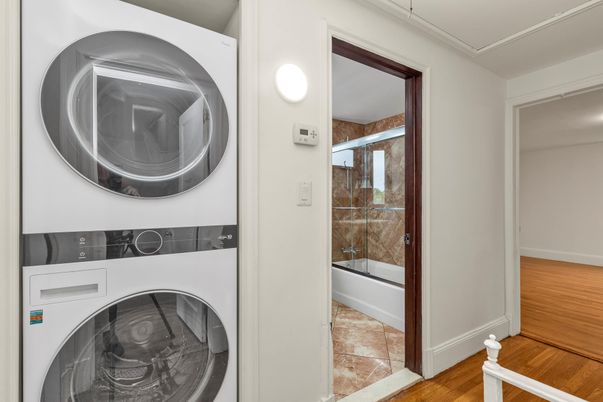 Bathroom, Glass Shower, Interior, Utility Closets, Washer, Wood Texture Flooring