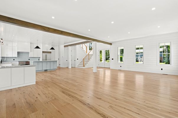 Empty room, Interior, Kitchen, Pendant Lights, Recessed Lighting, Stainless Steel Appliances, Wooden Beams, Wood Texture Flooring