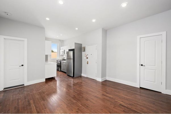 Interior, Kitchen, Recessed Lighting, Stainless Steel Appliances, Washer, Wood Texture Flooring