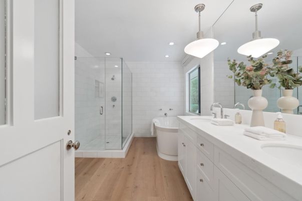 Bathroom, Dual Sink Vanities, Glass Shower, Interior, Pendant Lights, Recessed Lighting, Wood Texture Flooring