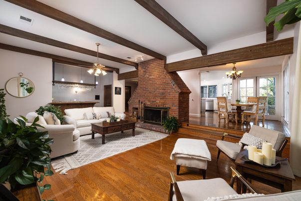 Chandelier, Dining room, Fireplace, Interior, Living room, Pendant Lights, Stone Walls, Wooden Beams, Wood Texture Flooring