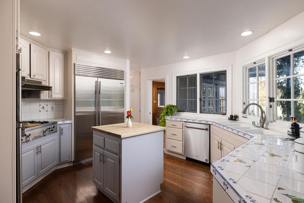 Interior, Kitchen, Recessed Lighting, Stainless Steel Appliances, Tile Countertops, Wood Texture Flooring