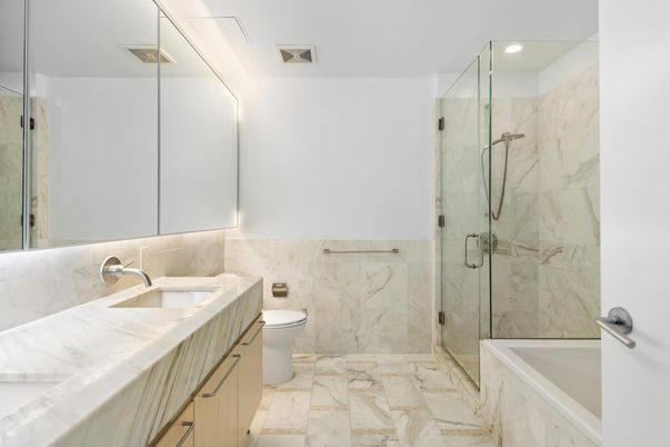 Bathroom, Dual Sink Vanities, Glass Shower, Interior, Marble, Marble Walls, Recessed Lighting