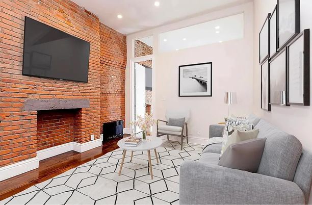 Fireplace, Interior, Living room, Recessed Lighting, Stone Walls, Wood Texture Flooring