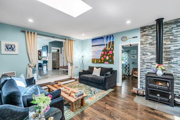 Fireplace, Interior, Living room, Recessed Lighting, Stone Walls, Wood Texture Flooring