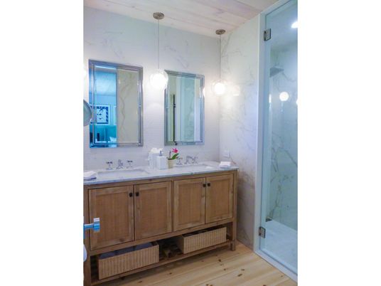 Bathroom, Dual Sink Vanities, Glass Shower, Interior, Marble Walls, Wood Texture Flooring