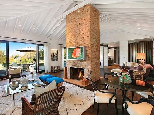 Dining room, Fireplace, Interior, Living room, Recessed Lighting, Stone Walls, Wood Texture Flooring