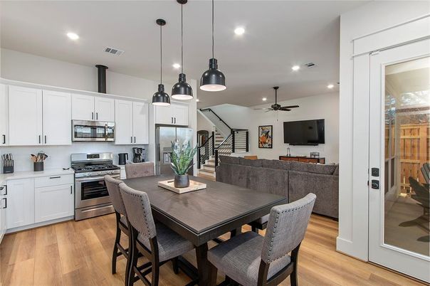 Dining room, Interior, Kitchen, Pendant Lights, Recessed Lighting, Stainless Steel Appliances, Wood Texture Flooring