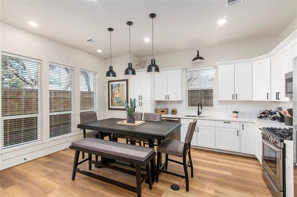 Dining room, Interior, Kitchen, Pendant Lights, Recessed Lighting, Stainless Steel Appliances, Wood Texture Flooring
