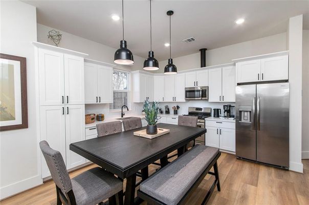 Dining room, Interior, Kitchen, Pendant Lights, Recessed Lighting, Stainless Steel Appliances, Wood Texture Flooring