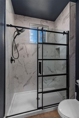 Bathroom, Glass Shower, Interior, Marble Walls, Wood Texture Flooring