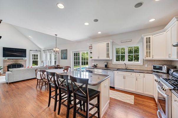 Dining room, Fireplace, Interior, Kitchen, Living room, Pendant Lights, Recessed Lighting, Stainless Steel Appliances, Wood Texture Flooring