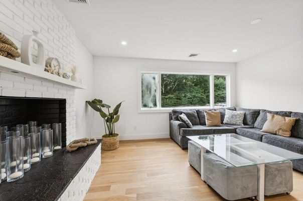 Fireplace, Interior, Living room, Recessed Lighting, Stone Walls, Wood Texture Flooring