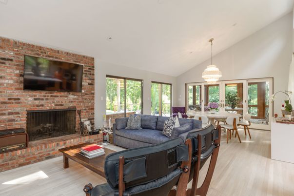 Dining room, Fireplace, Interior, Living room, Pendant Lights, Stone Walls, Wood Texture Flooring