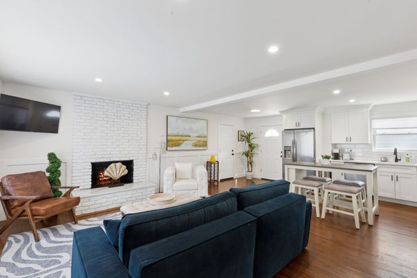 Dining room, Fireplace, Interior, Kitchen, Living room, Recessed Lighting, Stainless Steel Appliances, Stone Walls, Wood Texture Flooring