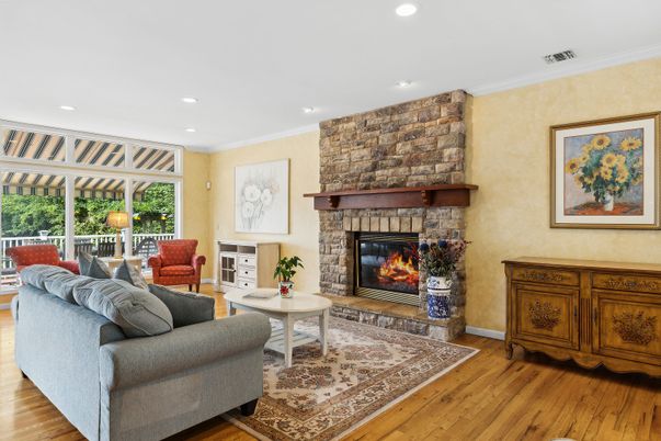 Fireplace, Interior, Living room, Recessed Lighting, Stone Walls, Wood Texture Flooring