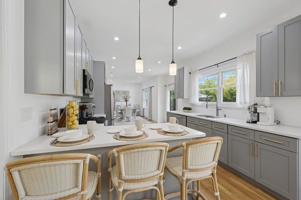Dining room, Interior, Kitchen, Pendant Lights, Recessed Lighting, Stainless Steel Appliances, Wood Texture Flooring